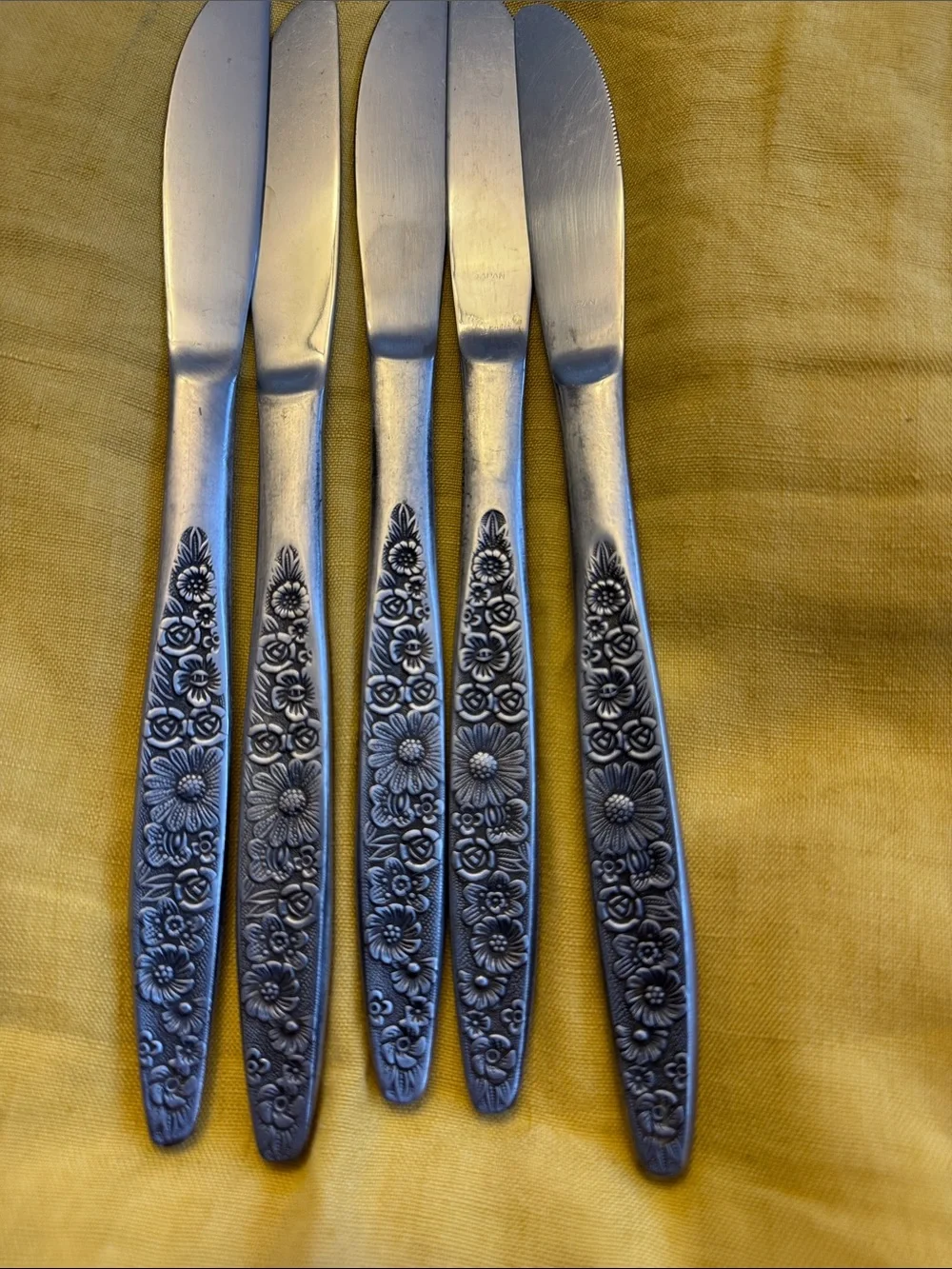 5 floral handled butter knives